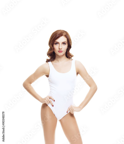 Fit and sporty girl in white underwear. Beautiful and healthy woman posing over isolated white background. Sport, fitness, diet, weight loss and healthcare concept.