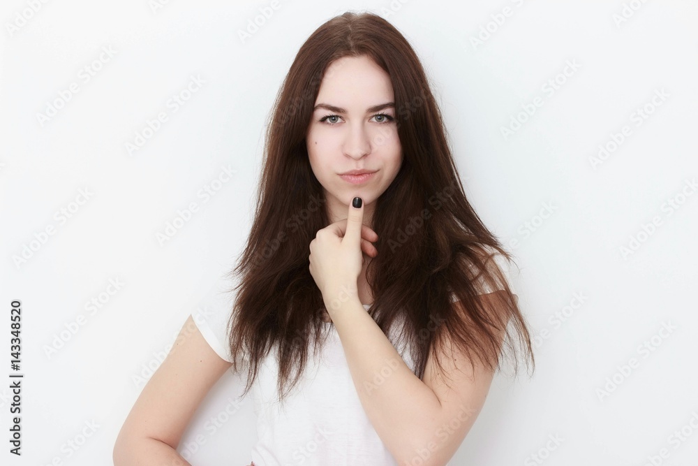 Young casual woman In pink blouse isolated over white background studio portrait Young casual woman In pink blouse isolated over white background studio portrait