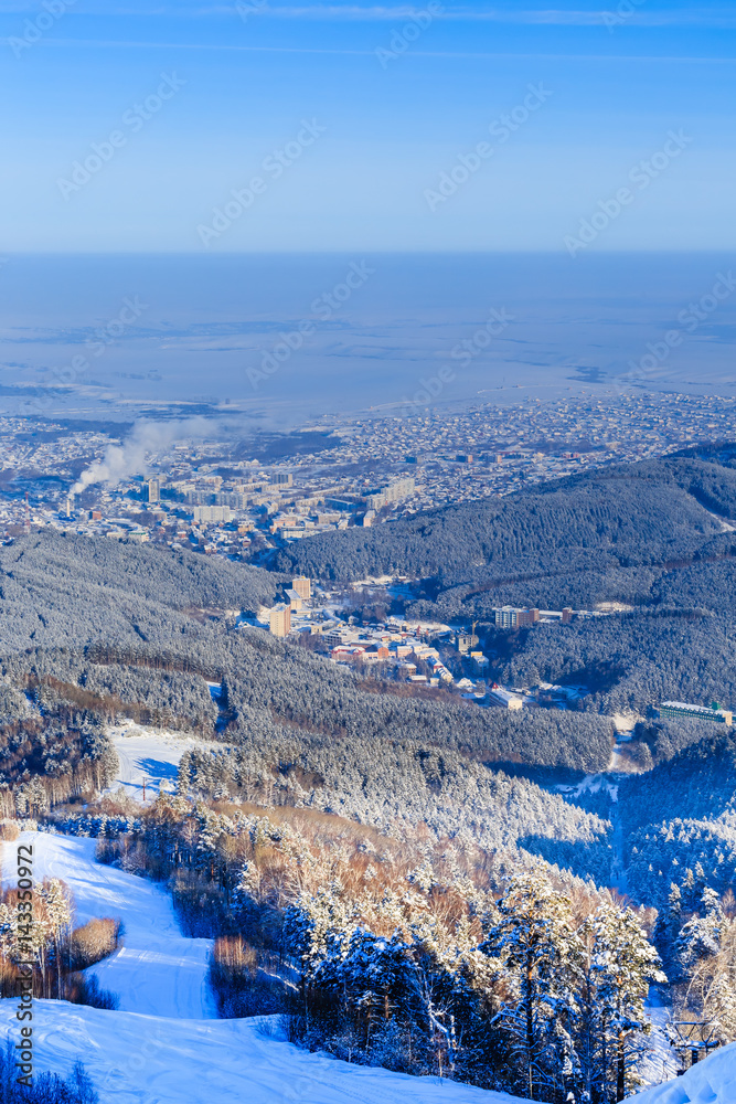 View from Tserkovka mountain to the resort town of Belokurikha in winter, Altai, Russia
