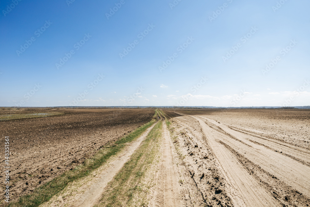 Ploughed field in spring prepared for sowing Ploughed field in spring prepared for sowing