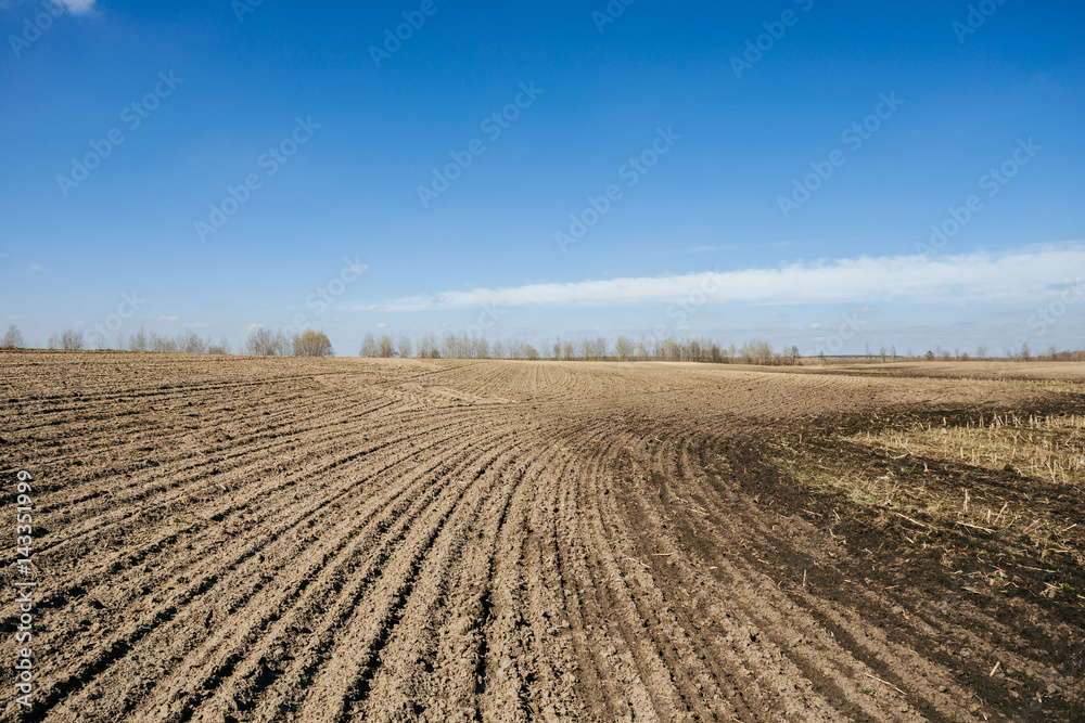 Ploughed field in spring prepared for sowing Ploughed field in spring prepared for sowing