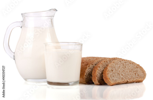 jug of milk with a loaf of bread isolated on white background