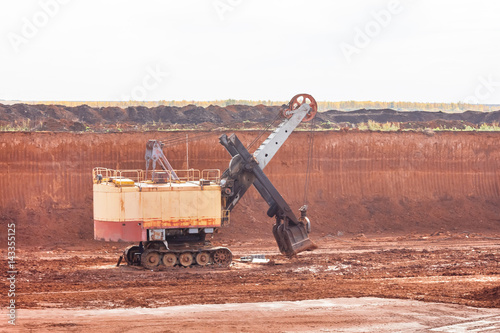 Track-type loader excavator machine on mining quarry