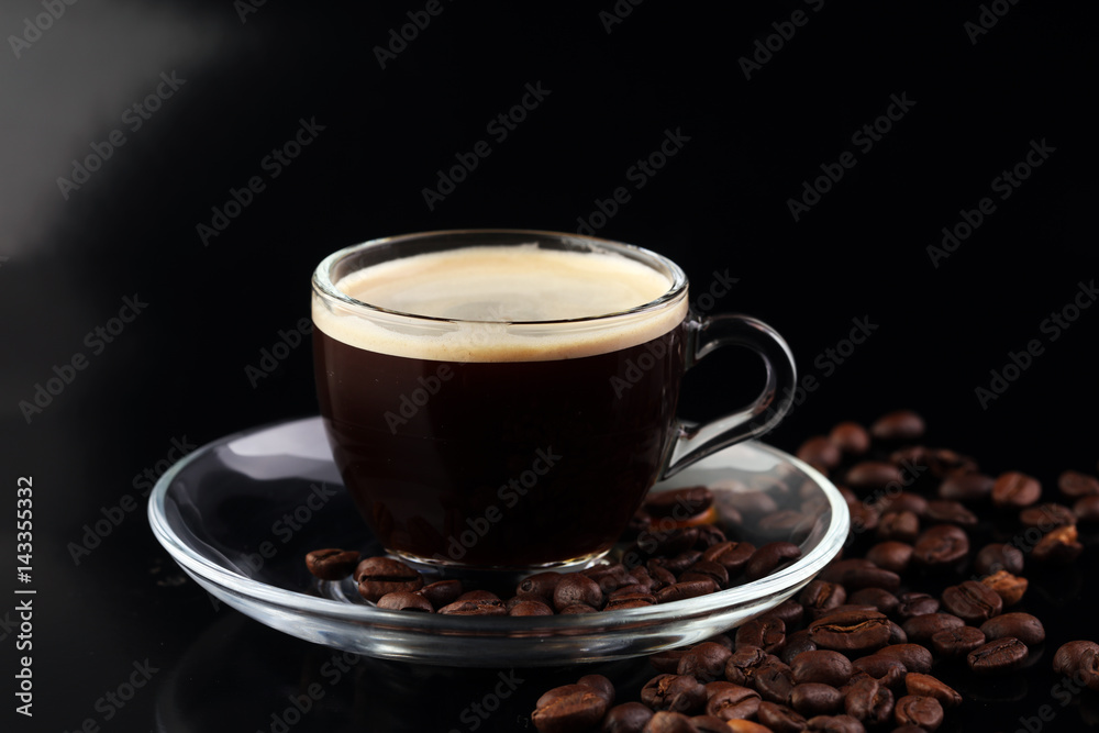 Coffee cup and coffee beans on table Coffee cup and coffee beans on table