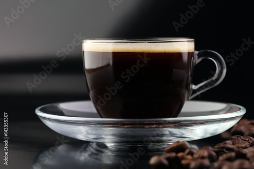 Fototapeta Naklejka Na Ścianę i Meble -  Coffee cup and coffee beans on table