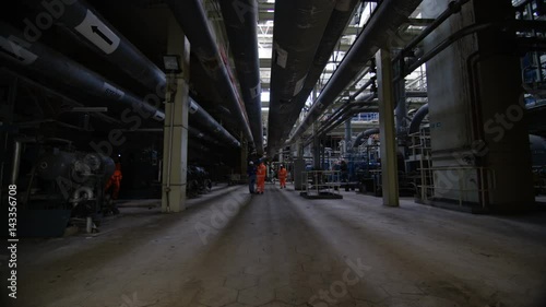 Wallpaper Mural  Team of engineers in power station, wide shot of workers & interior structure Torontodigital.ca