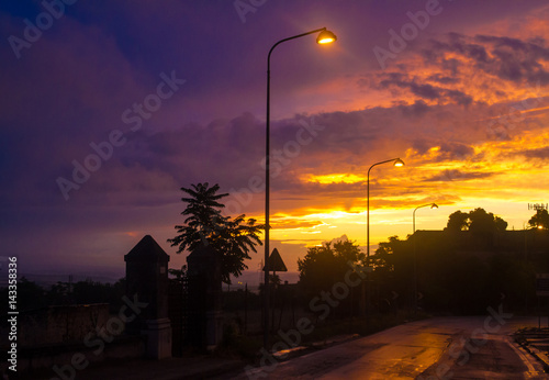 tramonto su una suggestiva strada in una giornata piovosa  photo