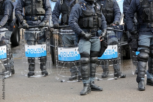 police with shields and riot gear during the sporting event photo