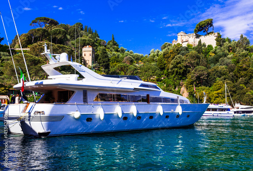 Luxury white yacht in harbour of Portofino, Italy © Freesurf