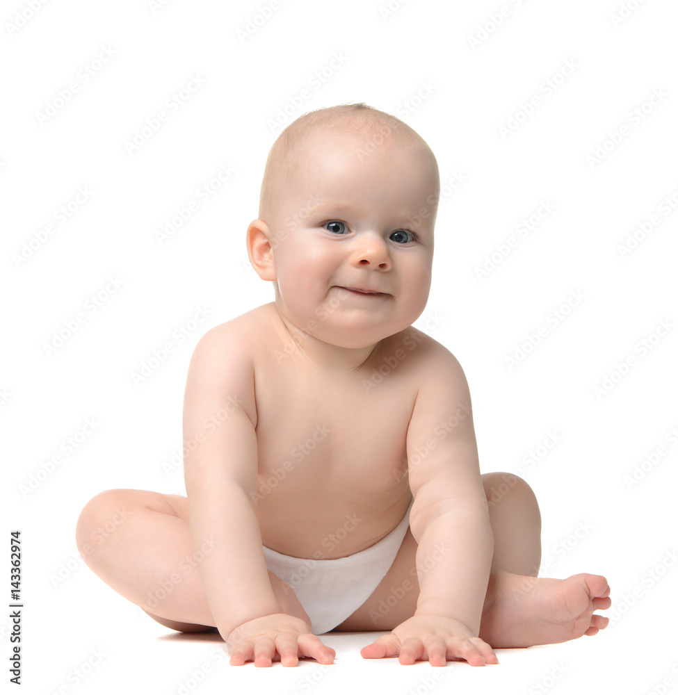 baby girl toddler sitting naked in diaper looking at the camera and happy smiling baby girl toddler sitting naked in diaper looking at the camera and happy smiling