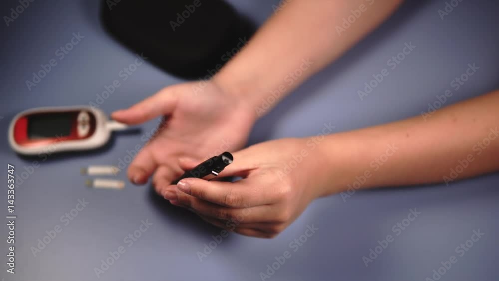 Close up self-testing for diabetes. Blood sampling from finger and flesh blood wound from diabetes patient finger Close up self-testing for diabetes. Blood sampling from finger and flesh blood wound from diabetes patient finger