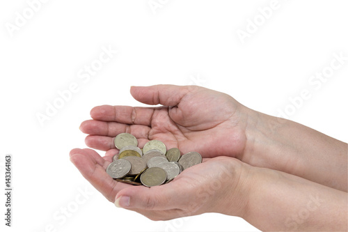 A handful of coins in the hands of an elderly woman