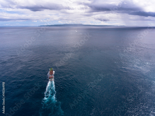 Aerial shot of the cargo moving in the sea