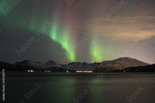 Northern lights reflected in seawater. Tromso, Norway. © Guilherme