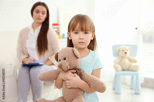 Little girl with teddy bear...