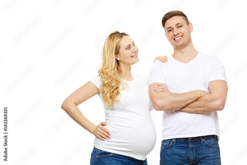 Young pregnant happy woman posing with her handsome husband Young pregnant happy woman posing with her handsome husband