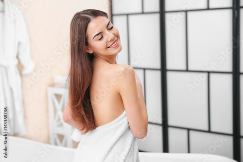 Beautiful young woman with towel going to take a bath at home Free Download Beautiful young woman with towel going to take a bath at home - GFXLoad