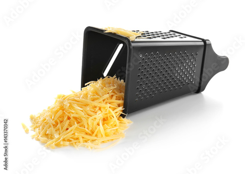 Metal grater and pile of cheese isolated on white