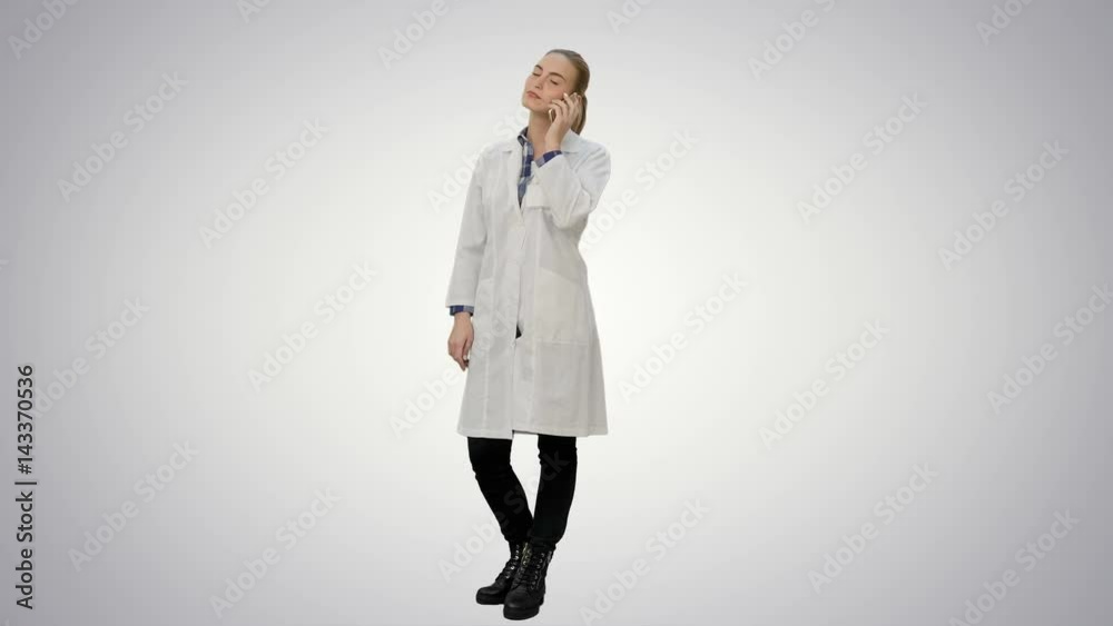Female doctor talk via cell phone with patient reporting good news on white background. Female doctor talk via cell phone with patient reporting good news on white background.