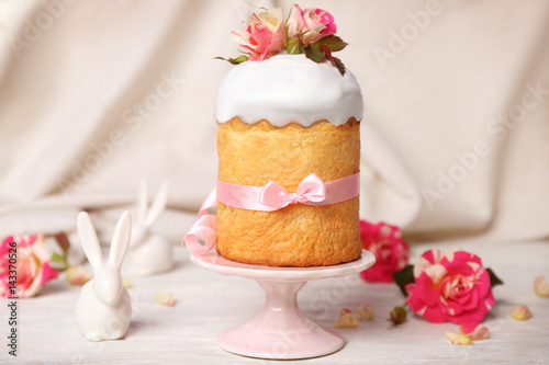 Easter cake decorated with flowers on ceramic stand