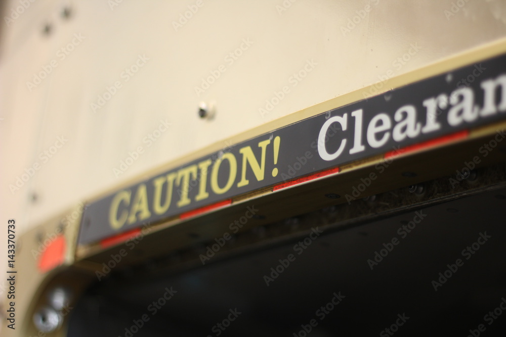 caution text sign board on the building for safety purpose caution text sign board on the building for safety purpose