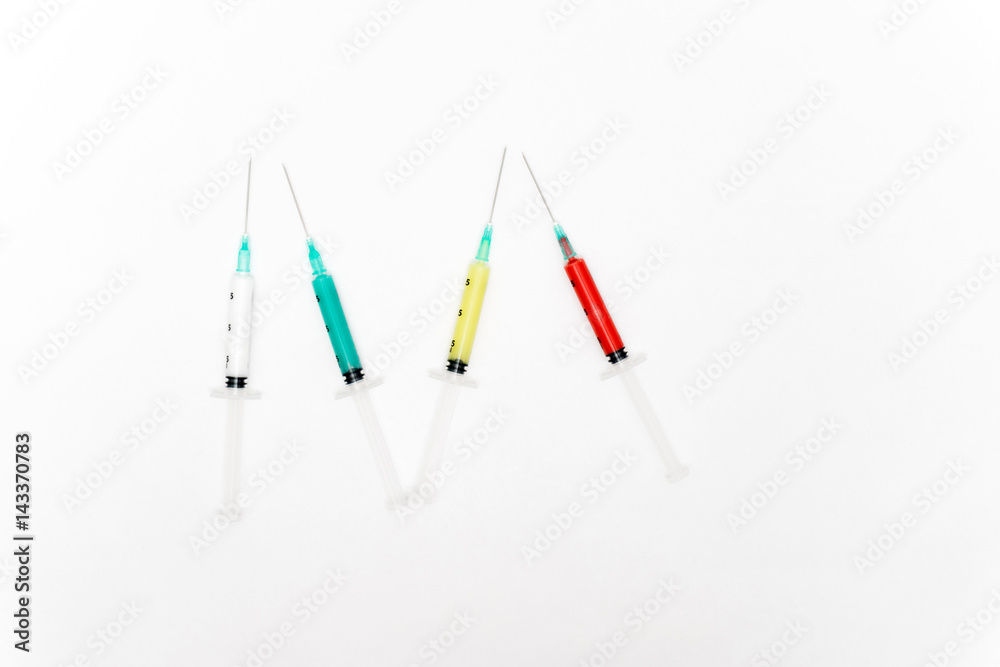 Medical colorful syringes isolated on white background