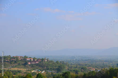 The view of mountain with clouds and blue sky