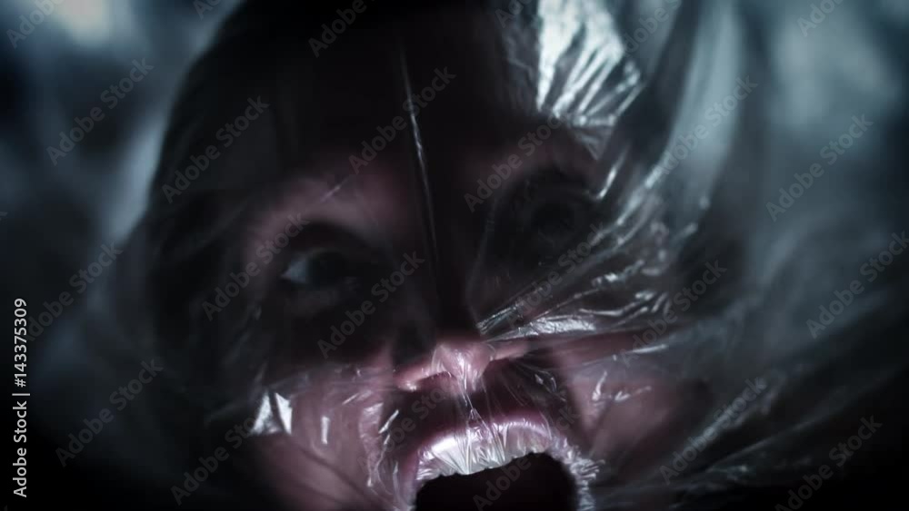 4K Horror Shot Of Woman Suffocating in Plastic Bag Stock ビデオ | Adobe Stock 