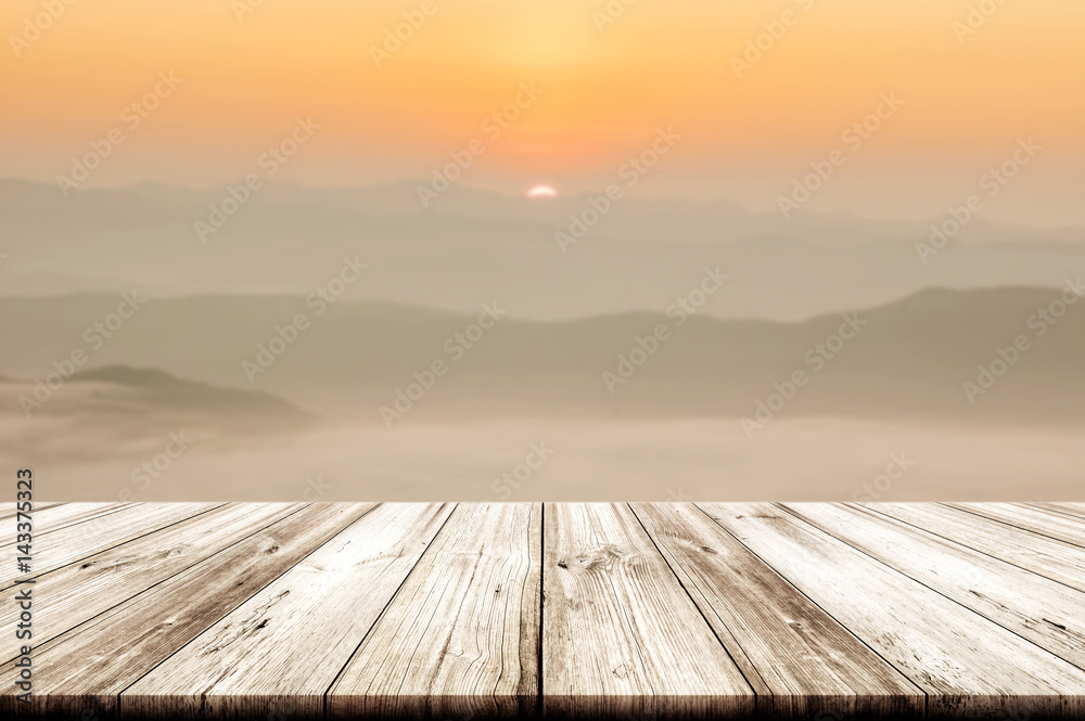 Empty wooden table top with beautiful morning landscape background.