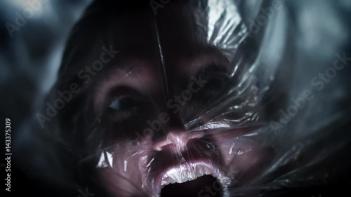 4K Horror Shot Of Woman Suffocating in Plastic Bag