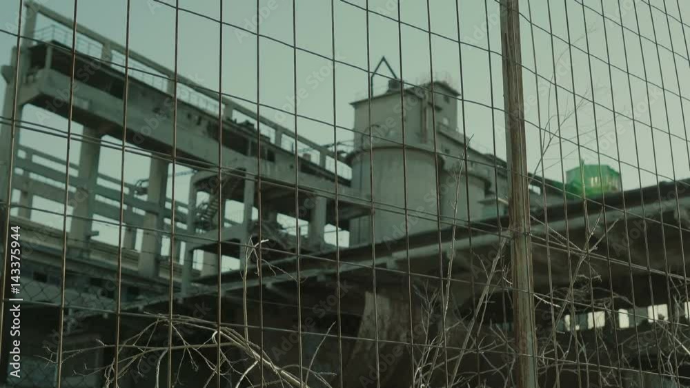 A long abandoned and outsourced cement factory in a city. A long abandoned and outsourced cement factory in a city.