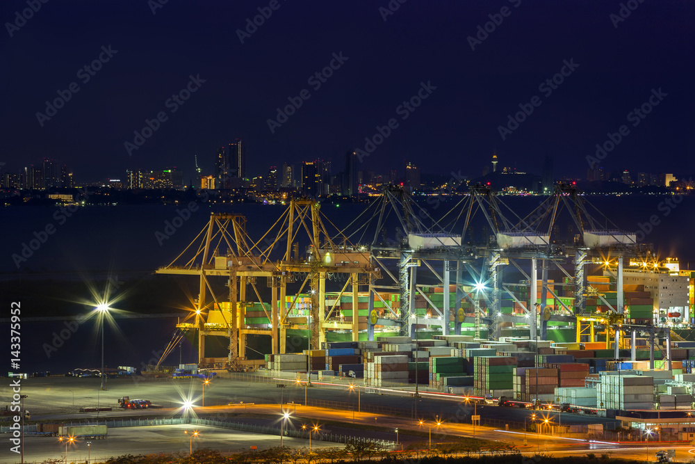 Shipping containers Adjacent to Port Used for freight elevator large ships ,lighting conditions for the early evening. Shipping containers Adjacent to Port Used for freight elevator large ships ,lighting conditions for the early evening.