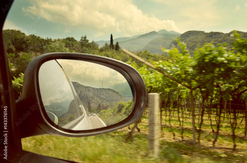 Lake Como. Driving on a scenic road near vineyards.  Summer time. European vacation, living, life style, rent a car and travel concept. Vintage post processed 