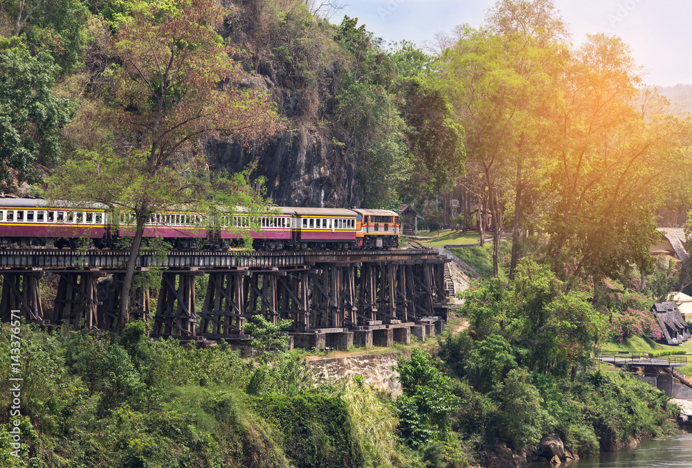 Obraz premium passenger thai train moving on death of railway between tham krasae railway station river kwai kanchanaburi Thailand