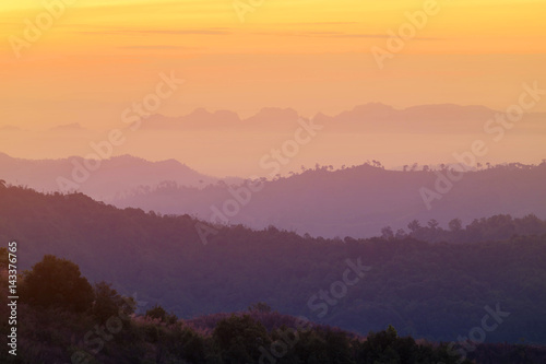high view sunrise in early morning over rainforest mountain in thailand 
