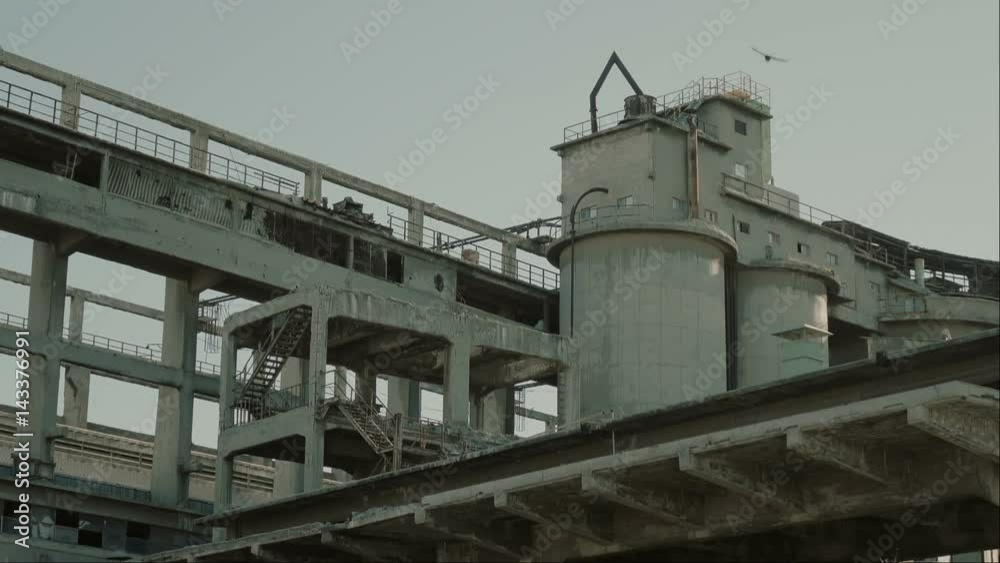 A long abandoned and outsourced cement factory in a city. A long abandoned and outsourced cement factory in a city.