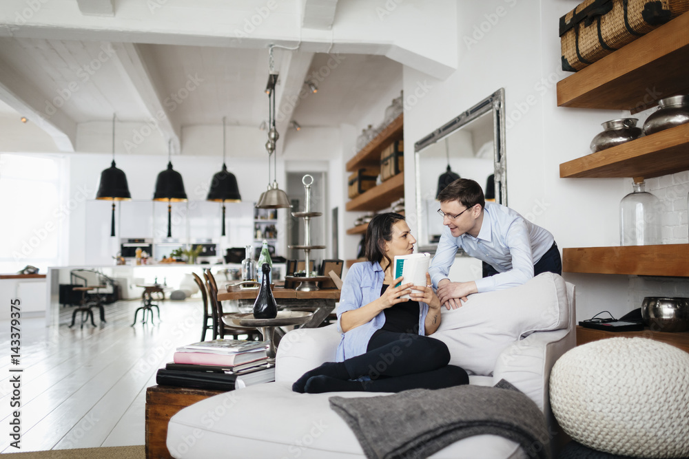 Germany, Mature couple talking in living room Germany, Mature couple talking in living room