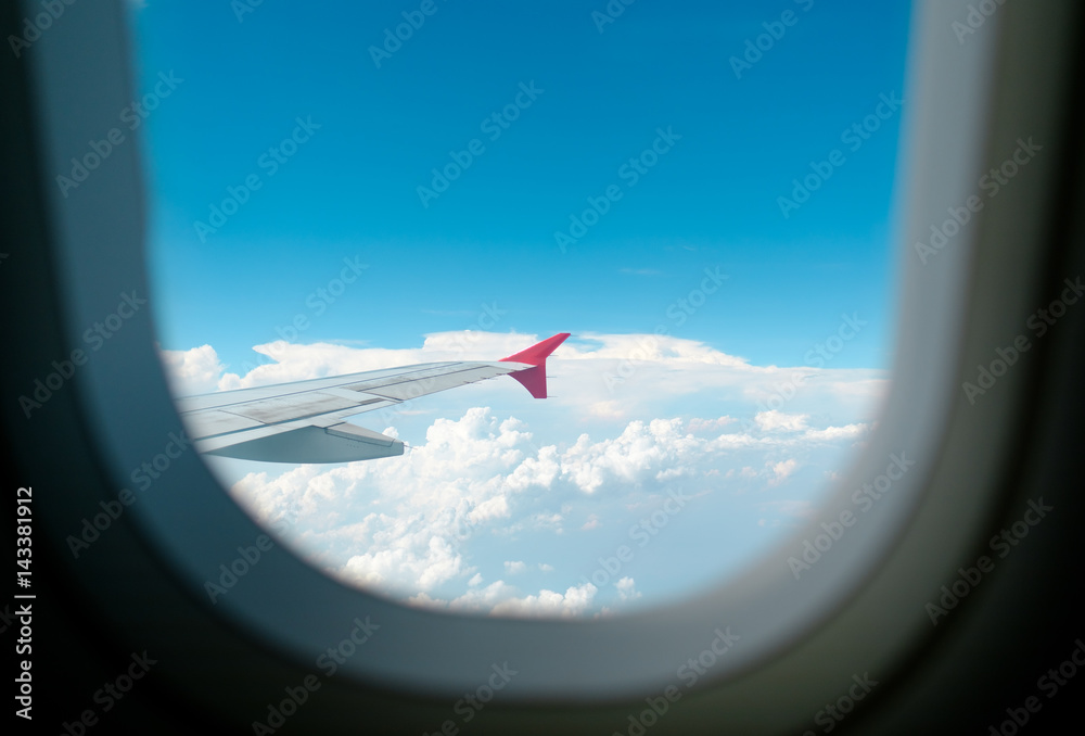 View of beautiful cloud and wing of airplane from window View of beautiful cloud and wing of airplane from window