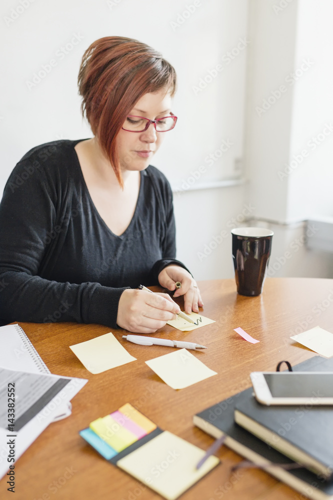 Sweden, Woman making notes during work meeting Sweden, Woman making notes during work meeting