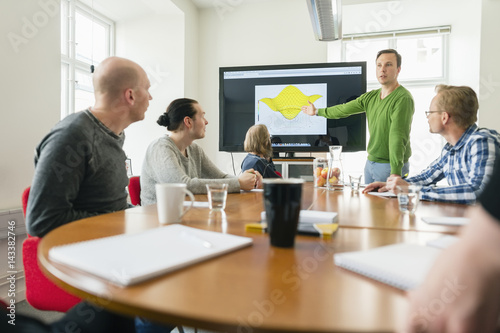 Business people discussing during meeting in the office photo