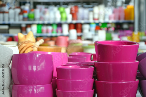 Many pink ceramic pots in store closeup.