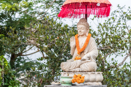 Buddha statue buddha image used as amulets of Buddhism religion. Tropical island Bali, Indonesia. North of Bali. photo
