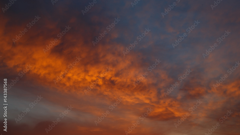 Spring orange  clouds  on the sky at the dawn for background