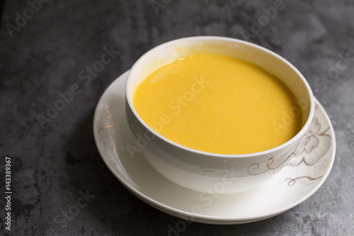 Pumpkin soup in the white plate