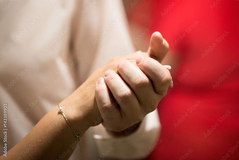 picture of man and woman holding their hands