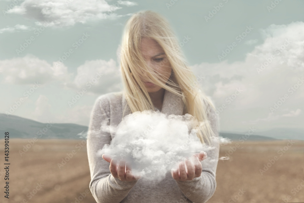surreal moment , woman holding in her hands a soft cloud - obrazy, fototapety, plakaty 