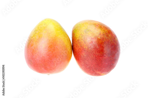Two ripe mango of red and orange colors