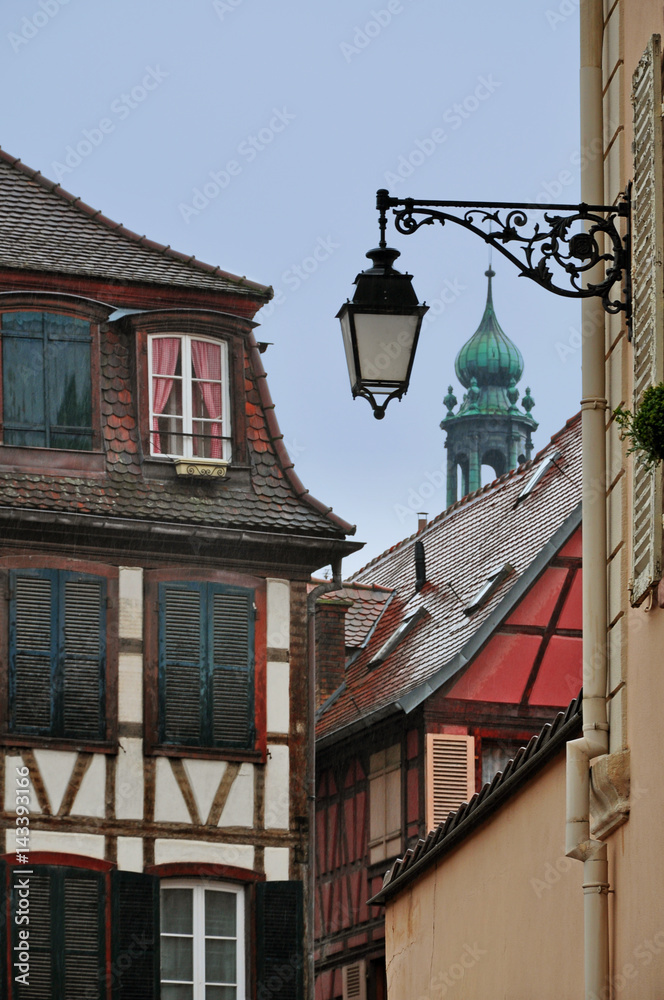Old street with lanterns and half-timber houses. Colmar, Alsace, France. Old street with lanterns and half-timber houses. Colmar, Alsace, France.