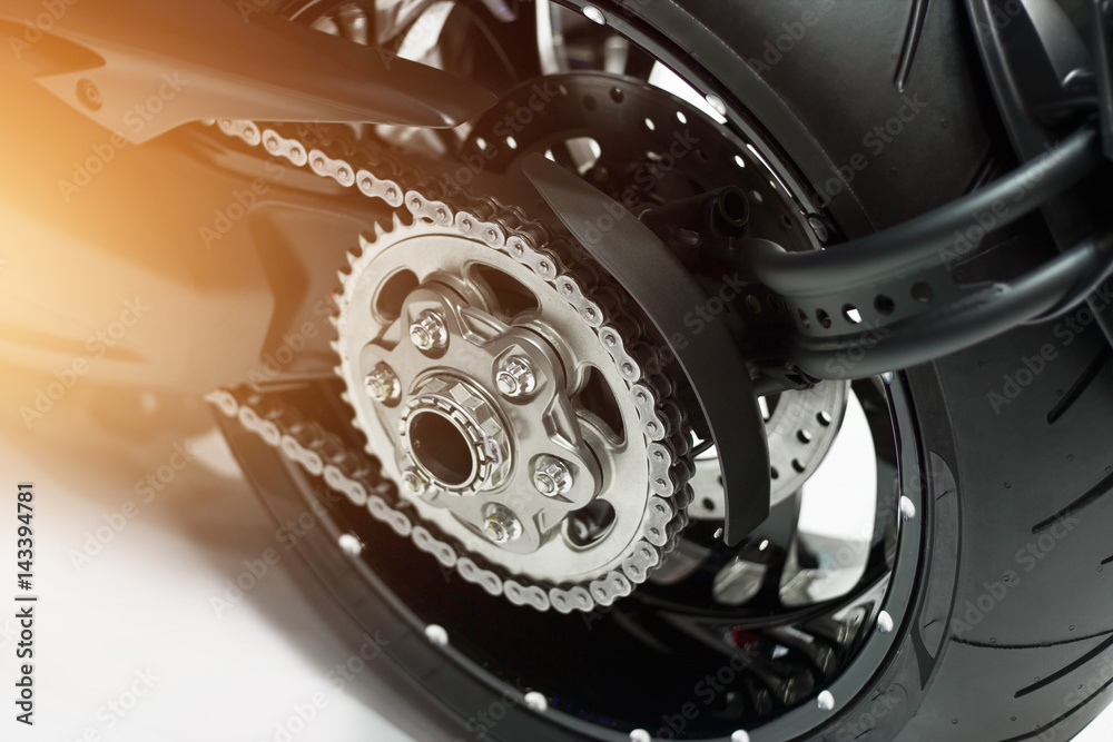 Fototapeta premium detail of a motorcycle rear chain and gear