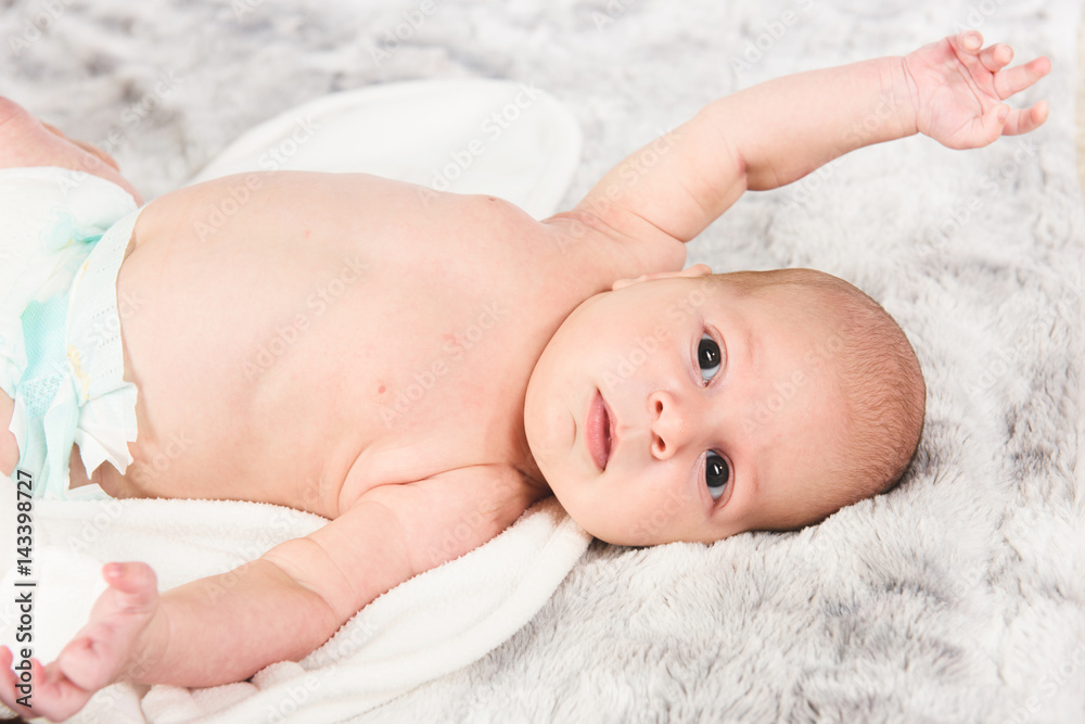 Boy Laying on Towel and Blanket Boy Laying on Towel and Blanket